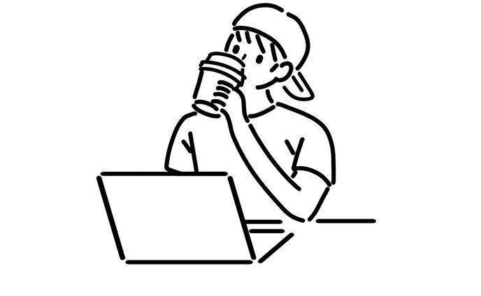 カフェでレポート作成する大学生