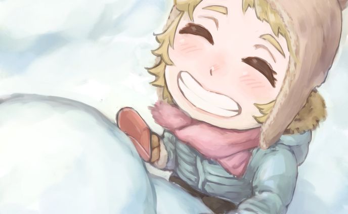 Little girl building a snowman 