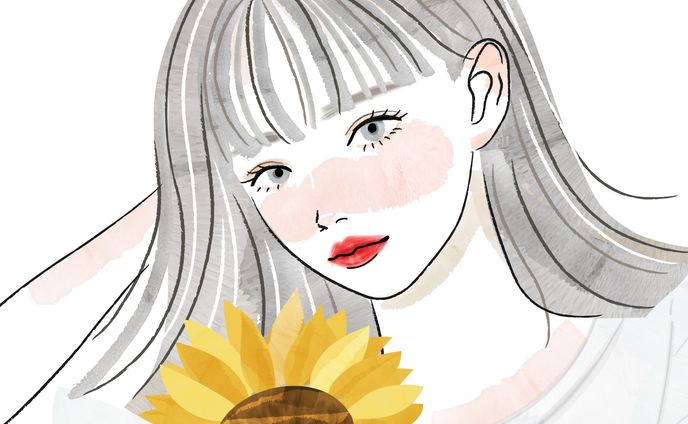 女性とひまわりの花