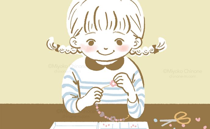 アクセサリーを作っている子供（オリジナル）